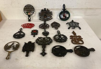 Lot of 17 Vintage Cast Iron Trivets &ndash; Train, Motto, Folk Art, Painted & Unpainted, Assorted Shapes