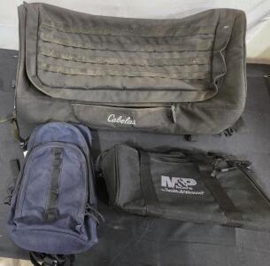 (1)ATV Rack Pack With Cover (Cabela's) (1) M&P Shooting Gun Bag (Black) (Smith & Wesson) (1) Day Use Travel Back Pack (Blue) (Medium Size)
