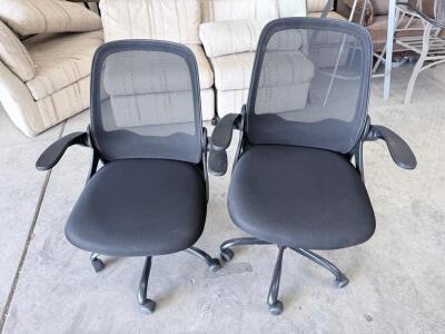 Pair of Black Mesh Office Task Chairs with Fixed Arms, Swivel, and Casters