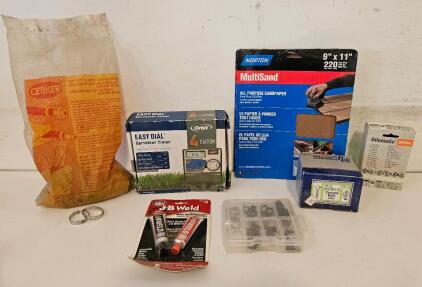 Variety Lot including: J-B Weld Steel Reinforced Epoxy Adhesive Twin Tube Pack 2 x 1 oz, Box of Hose Clamps varying in size, Orbit Easy Dial Sprinkler Timer, 3 Pack of Norton 220 Grit Sandpaper, Carriage Bolts, Saw Chain, and more.