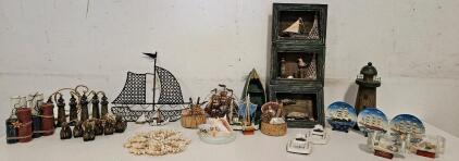 Nautical-themed Lot including: Nautical Dioramas (boats, shells, mollusks, etc.), several different styles of boat made of either wood or metal, buoys, lighthouses, etc.