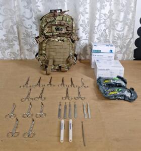 (1) Tactical First Aid Backpack, Cammo, (1) 25-Count Box Of ABD Pads, (1) 12-Count Box Of Guaze Rolls, (2) Voodoo Tactical 6" Emergency Bandages, (5) Pair Of 5" Curved Locking Forceps, (5) Pair Of 5" Straight Locking Forceps, (5) Pair Of 5" Angled Sciss