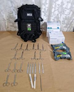 (1) Tactical First Aid Backpack, Black, (1) 25-Count Box Of ABD Pads, (1) 12-Count Box Of Guaze Rolls, (2) Voodoo Tactical 6" Emergency Bandages, (5) Pair Of 5" Curved Locking Forceps, (5) Pair Of 5" Straight Locking Forceps, (5) Pair Of 5" Angled Sciss