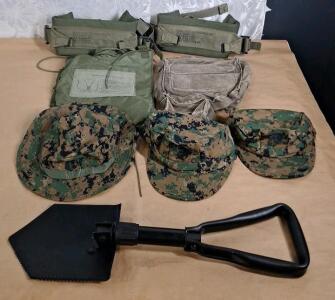 (1) Folding Shovel, (2) Marines - Cammo Caps, Large & Medium, (1) Marines - Cammo Hot Weather Hat, Medium (1) 5Qt Collapsible Canteen, (1) Canvas Satchel & (2) Waist Straps W/ Lower Back Pad