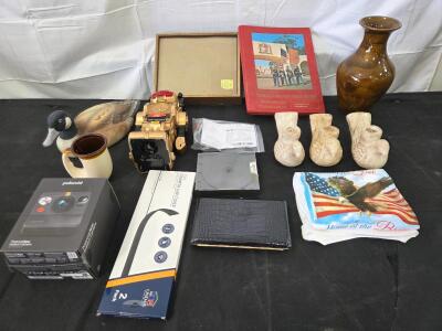 (1) Egyptian vase- Delilah.B 10/1982<br/>(1)Black Wallet <br/>(1)American Flag T-Shirt (Lg)<br/>(1)Counter Top strip cover (new)<br/>(1)Polaroid Camra <br/>(1) CD- Music<br/>(1) Ceramic Horn Mug<br/>(1) Robo Bot Toy<br/>(1) Ceramic GOOSE<br/>(1)Metal moun