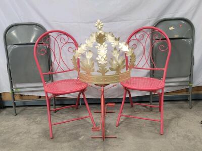 Assorted Outdoor Decor including: (2) Red Patio Chairs, (2) Folding Metal Chairs, (1) Golden Colored Wall Hanging Decor, & (1) Red Bicycle Accessory.
