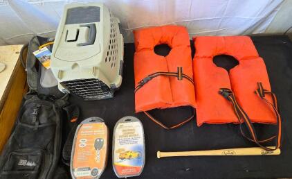 Outdoor lot: (2) life jackets, kids Louisville baseball bat, Outdoor Products 2L hydration pack, WFS element gear backpack, Petmate kennel cab small dog crate, Bulldog security remote vehicle start system, Universal learning bypass module. Please inspect 