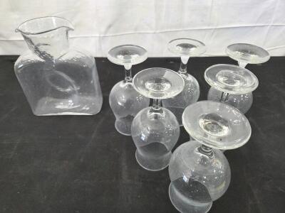 Drinkware lot: Blenko water jug with double water pouring spouts and (6) ALE Tulip Glasses. Please inspect in person, see photos.