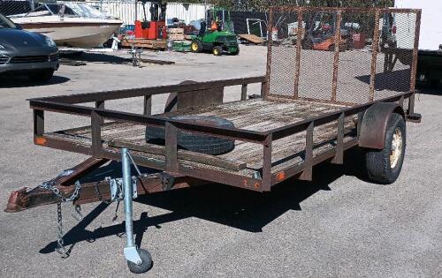 12' x 7' Single-axle utility trailer with a wooden deck and a wire mesh rear ramp