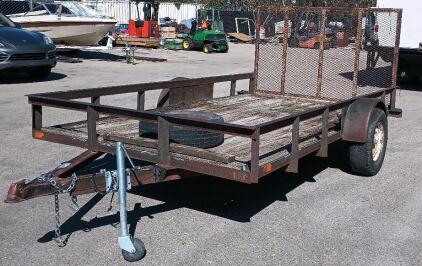 12' x 7' Single-axle utility trailer with a wooden deck and a wire mesh rear ramp