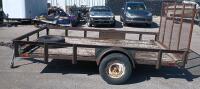 12' x 7' Single-axle utility trailer with a wooden deck and a wire mesh rear ramp - 5