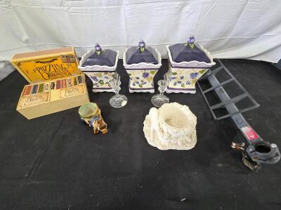 Home decor lot: 3 ceramic containers with lids, brain puzzler game, vintage donkey planter, animal figurine, and more! Please inspect in person and see photos.