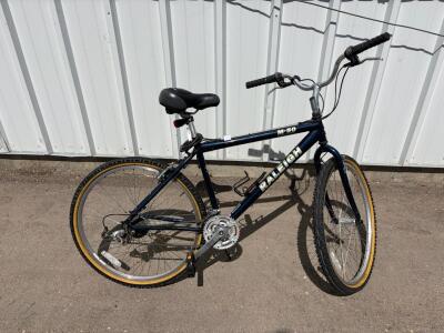 Raleigh M-50 Mountain Bike, 26" Wheels, 18-Speed, Steel Frame, Rigid Fork, Blue. Tires need air, back tire needs reattached. please inspect in person.
