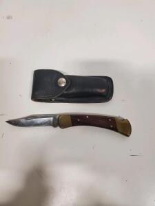 Buck 110 Folding Hunter Lockback Knife, 3.75" Blade, Brass Bolsters, Wood Handle, Leather Sheath