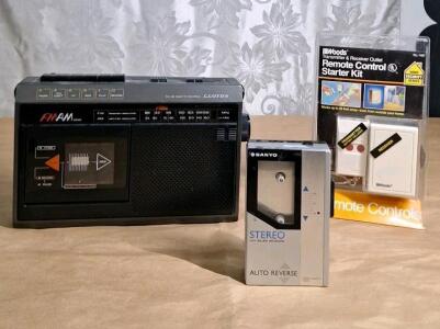 (1) Vintage Lloyd's Portable Am/Fm Radio Cassette Recorder, (1) Vintage Sanyo Portable Battery Operated Stereo Cassette Player & (1) Remote Controlled Outlet
