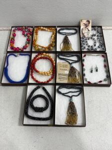 Handmade necklaces(10), variety of styles and lengths. One necklace comes with matching earrings and one comes with matching earrings and bracelet. please inspect in person.