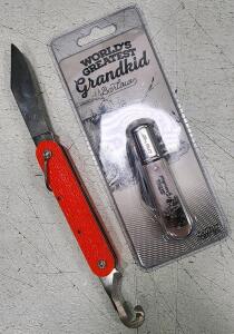 (1) Vintage Camillus Nee York 1950-1970s Orange Paratrooper Switch Blade Knife (1) World's Greatest Grandkid" Novelty Pocket Knife from Novelty Knife Co.