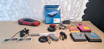 (2) Vintage Nintendo Entertainment System (NES) Controllers, (1) Vintage Nintendo Entertainment System (NES) Zapper Light Gun & (2) Vintage Nintendo Entertainment System (NES) Games & More