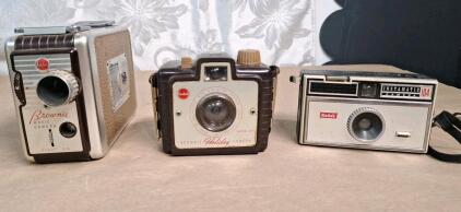 (1) Vintage Kodak Brownie 8mm Movie Camera II, (1) Vintage Kodak Brownie Holiday Camera & (1) Vintage Kodak Instamatic 104 Camera