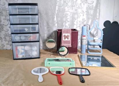 (1) 5-Tier Plastic Storage Cabinet W/ (30+) Assorted New & Used Lightbulbs, (3) Makeup Mirrors, (3) Hand Mirrors, (1) Trash Bin (1) Bathtub Mat & (1) Shower Caddy