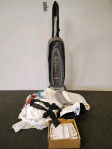 Oreck XL Pro Plus II Upright Vacuum Cleaner, Model RU4180BOX, 120V, 4.0 Amps, 8-Quart Capacity, sheets various colors, sheet holder and miscellaneous sewing material.