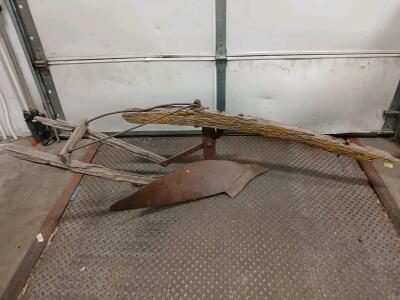 Antique Horse-Drawn Single-Bottom Walking Plow with Wooden Handles and Metal Moldboard