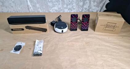 (2) New Pairs Of Earbuds, (1) USB Soundbar, (1) Swivl SW2782 Robotic Platform for Video, (1) Pair Of 3.5mm Jack Speakers & (1) Set Of 4 Extension Cord Covers