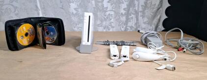 (1) Nintendo Wii Console W/ Accessories & (1) CD Holder W/ Assorted Wii & Xbox Games