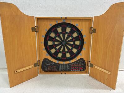 (1) cricket brand digital dart board in case,( 20) vintage toys, (1) house of Lloyd Christmas snowglobe, (1) vintage cow cookie jar.