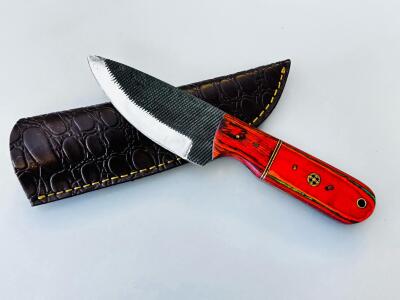 Fixed Blade Knife With Patterned Blade, Red Wood Handle, And Leather Sheath