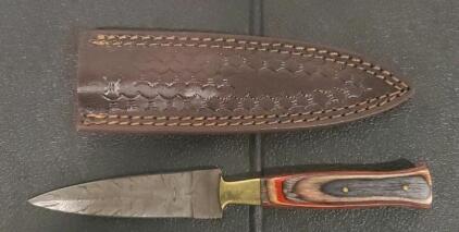 Fixed-Blade Knife with Patterned Steel Blade, Laminated Wood Handle, and Leather Sheath