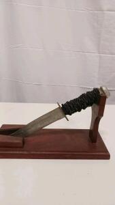 Vintage Bowie-Style Combat Knife with Cord-Wrapped Handle and Display Stand