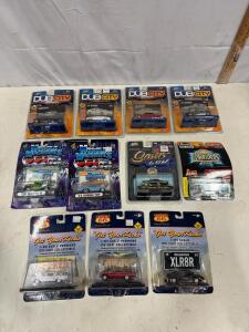 Lot of 11 1:64 Diecast Cars DUB City, Muscle Machines, Route 66, Jada, Revell &ndash; Sealed Cards