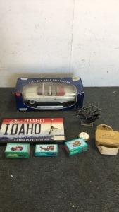 (1) Idaho License Plate Clock (3) Miniature Die cast Pencil sharpener (1) Tin Sail boat (1) Army field First Aid Kit Box (1) Waltham Pocket Watch (1) Moto Max 1:18 scale 1960 Impala