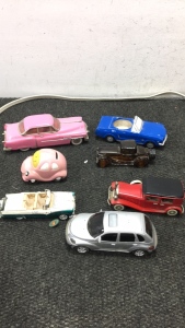 (4) Die Cast Toy Cars (1) Car planter (1) Car Bank (1) Avon Car