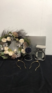 Wreath, candle holder, scale, harps, quartet.