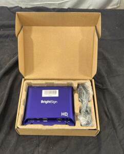 Brightsign HD223 digital signage player in purple.
