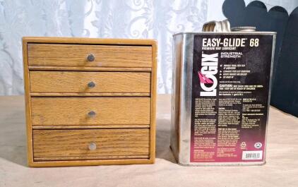(1) Small Wooden 4-Drawer Cabinet W/ Assorted Machining Bits & (1) Half Full Gallon Of Machining Oil