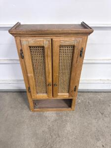 Vintage Wall-Mounted Wooden Cabinet with Cane Doors and Open Shelf