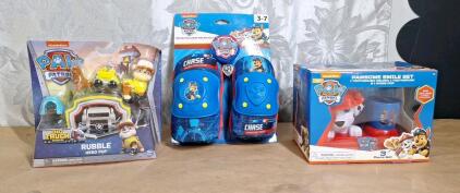 (1) Nickelodeon Paw Patrol Rubble Hero Pup Action Figure Set, (1) Nickelodeon Paw Patrol Toothbrush Accessories Set & (1) Nickelodeon Paw Patrol Bicycle Protective Gear & Bell Set.