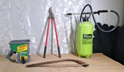 (1) Vigoro Hand Held Spreader, (1) Smith 2-Gallon Sprayer, (1) Pair Of Limb Loppers & (1) 20" Bow Saw