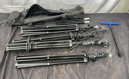 (2) lighting tri pods (2) camera tri pods (3) extra legs and transfer case