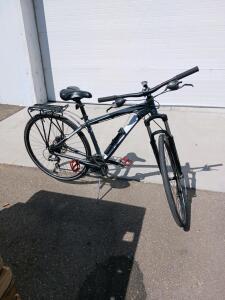 Hybrid City Bike with Front Suspension, Rear Rack, and Shimano Shifters