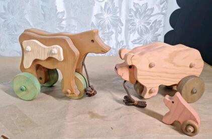 (2) Vintage Handcrafted Wooden Animal Pull Toys, (1) Cow & (1) Pig W/ Piglet