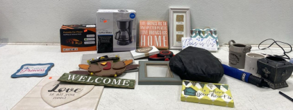 Mainstays 5-Cup Coffee Maker, Portable Car Player, Decorative Plaques, and More. The light gray candle lights do not work.