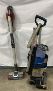 Shark CarpetXpert&trade; with StainStriker&trade; Upright Deep Carpet Cleaner & Cordless Stick Vacuum both power on.
