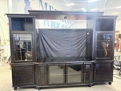 Large Black Wooden Entertainment Center with Glass Doors and Shelving
