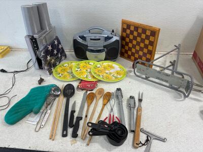 Tongs, wooden spoons, serving spoons, measuring cup set, (3) Sunflower plates, VENTURER Stereo Cassette recorder( untested),Durabrand HT-377 home theatre system( tested) And More!
