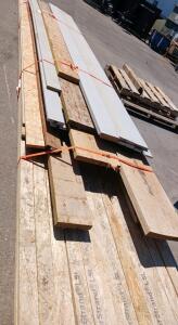 Mixed Pallet of Construction Lumber, OSB Sheets, and Siding Boards