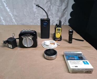 (1) HONEYTONE Mini Electric Guitar Amp, (1) Mini Cordless Air Compressor, (1) Pair Of Walkie Talkies W/ Charger Base, (1) Duracell LED Flashlight, (1) Belkin iPhone Auto Charger & (1) Nest Thermostat